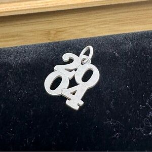 JAMES AVERY Sterling Silver Year 2004 Charm Pendant; RETIRED